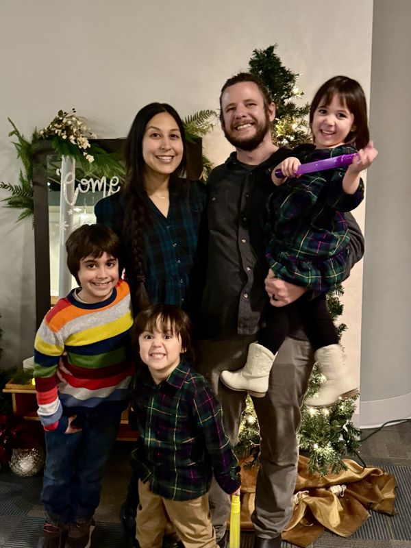 Lucas Hennenfent with his wife and three kids